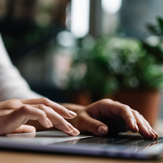 Person typing on laptop