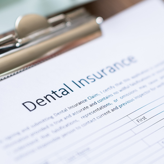 Dental insurance form on a clipboard