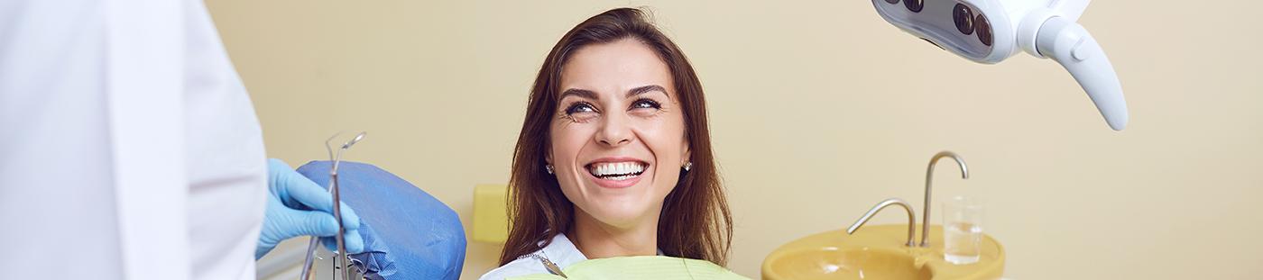 Happy patient shaking dentist’s hand