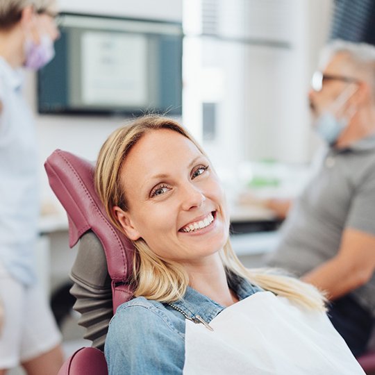 Middle-age female patient in treatment chair