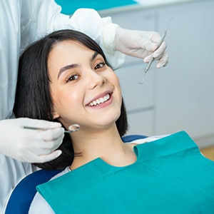 Smiling dental patient ready to undergo exam