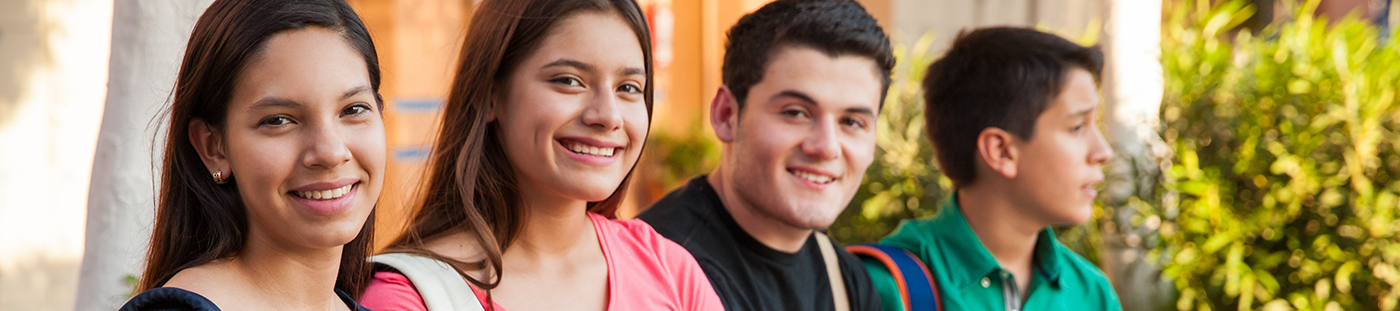 Four teenagers smiling after orthodontics in Arleta