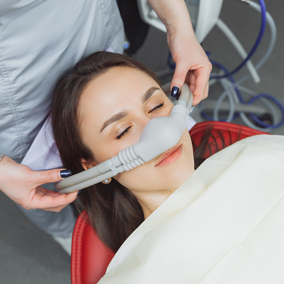 Dental patient with nitrous oxide mask over their nose