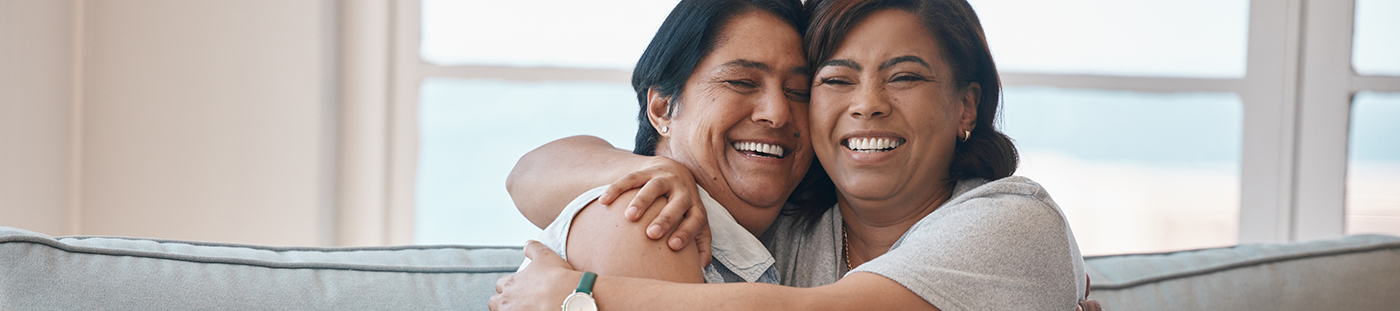 Two people hugging and smiling after wisdom tooth extractions in Arleta